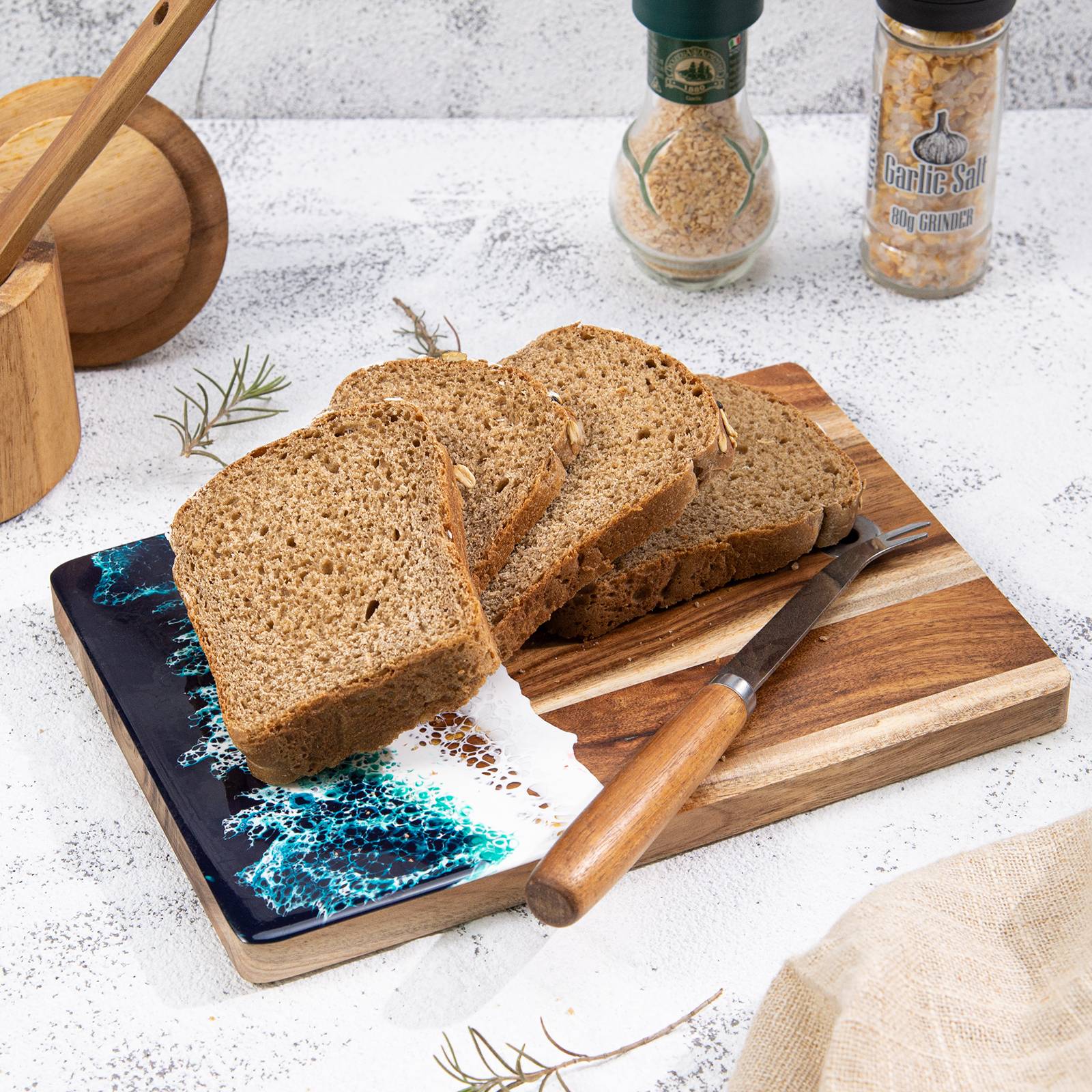 Acacia wood resin cutting board side view showing 9.6 inch size