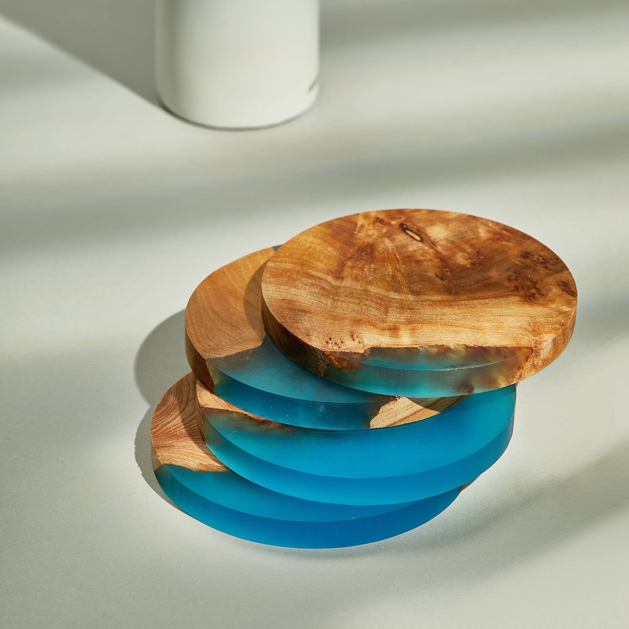 Close-up of acacia wood resin coaster showing unique marbled resin design