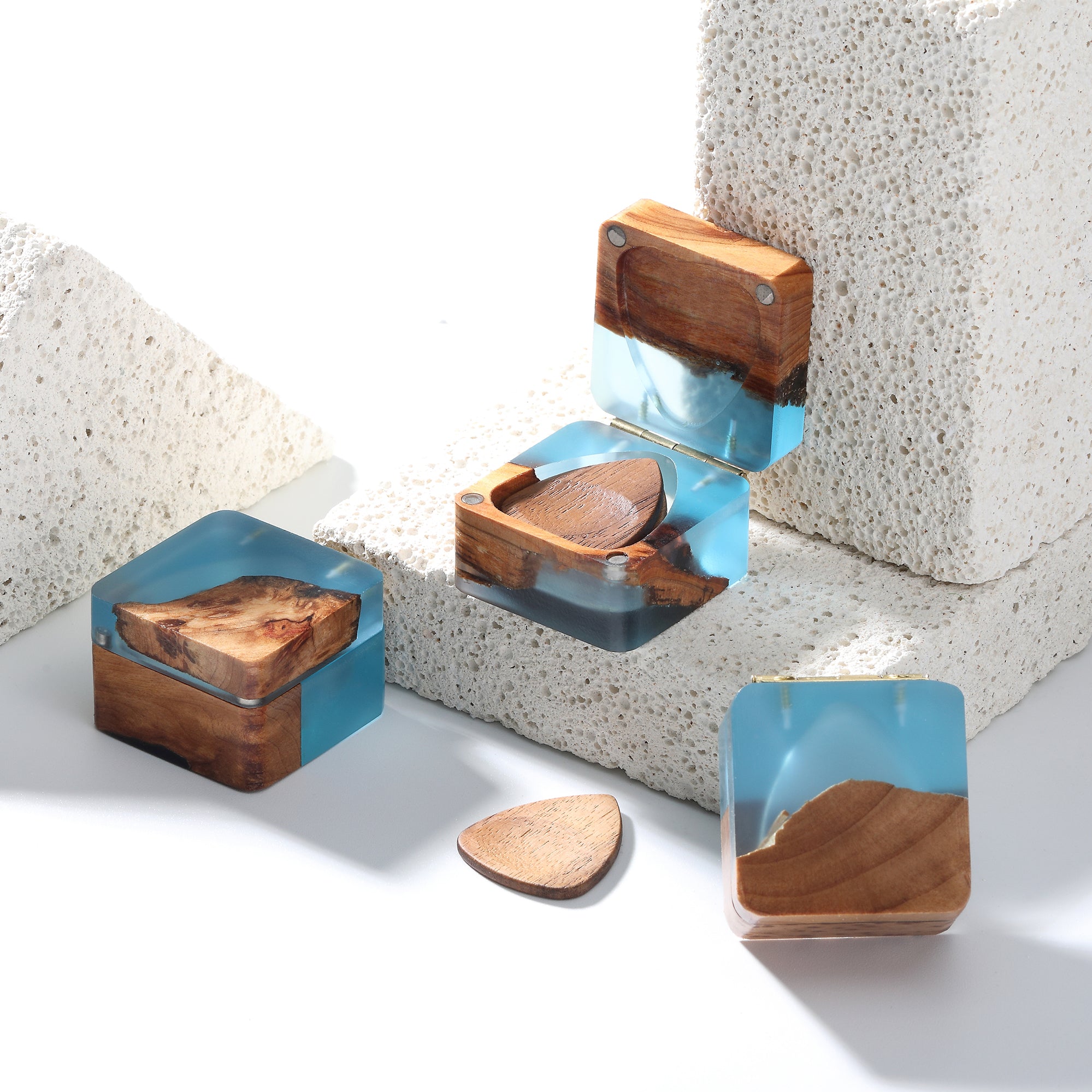 Resin guitar pick case open showing guitar picks stored inside