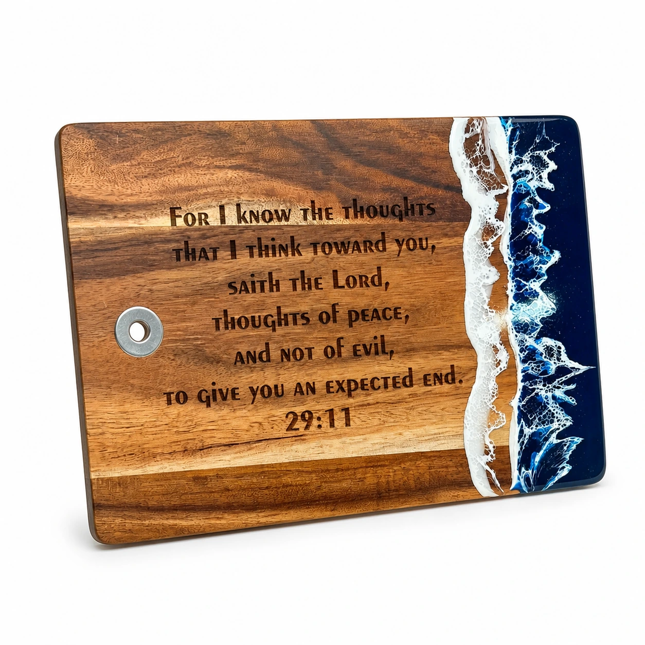 Blue ocean resin and acacia wood cutting board engraved with Jeremiah 29:11 on a white background