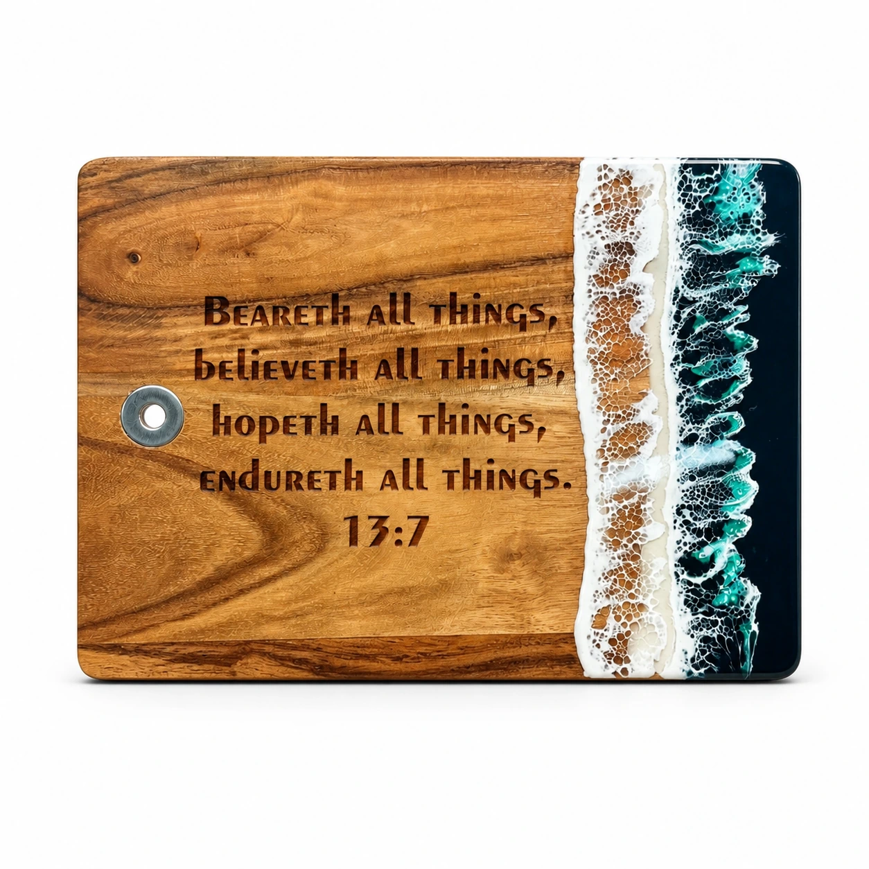Forest green ocean resin and acacia wood cutting board engraved with a Bible verse on a white background
